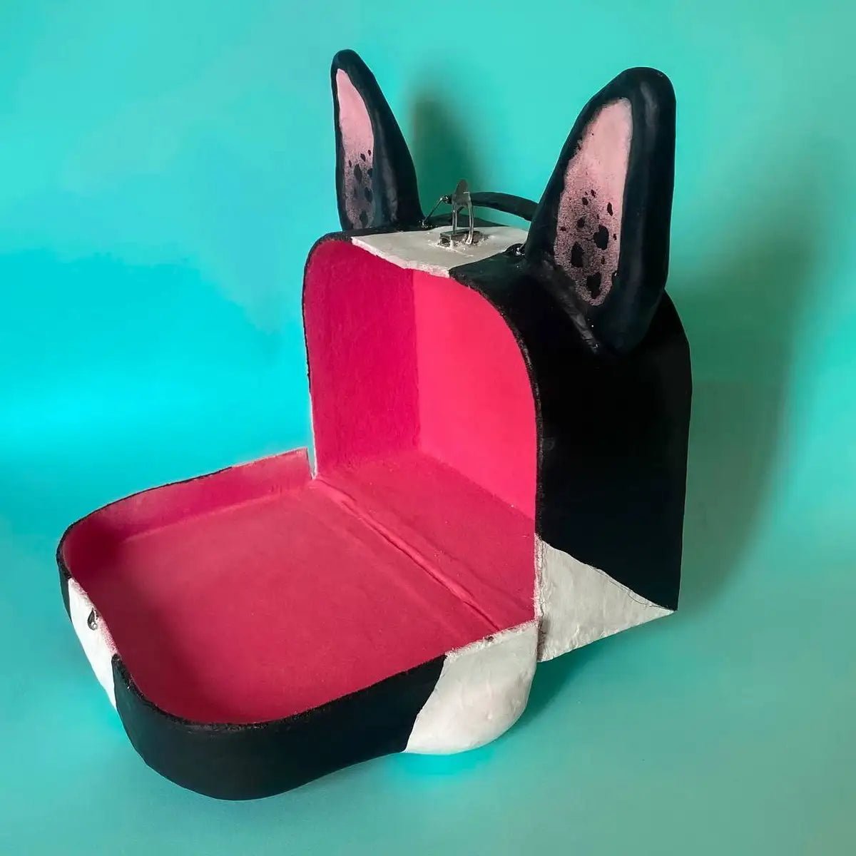 Side view of suitcase interior showing pink lining