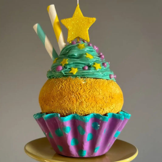 Rear side view of cupcake sculpture with textured frosting