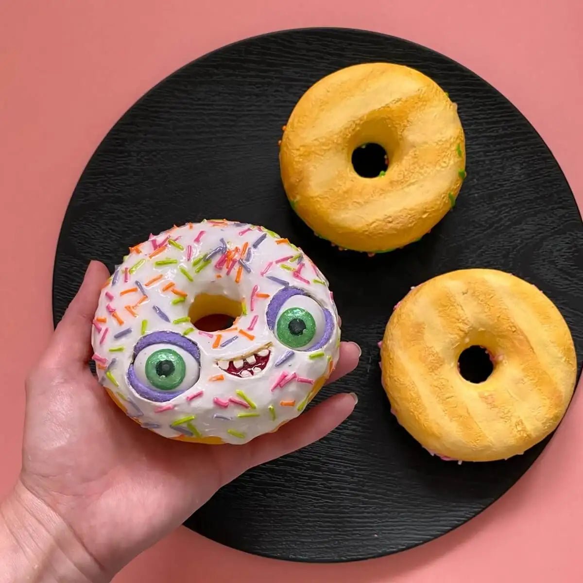 Artistic donut the real donuts on a black plate