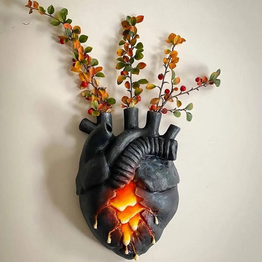 Heart wall vase mounted with branches inserted in glass tubes