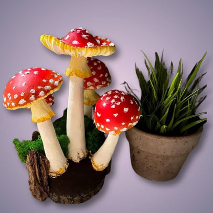 Decorative forest scene with papier-mâché amanita mushrooms – handmade arrangement with moss and plant on lilac background