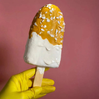 Papier-mâché sundae sculpture with coconut flakes – held from the side