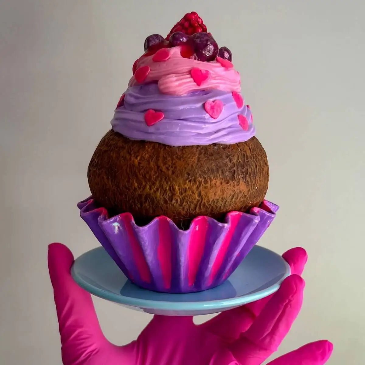 Back view of papier-mâché cupcake showing raspberry frosting detail