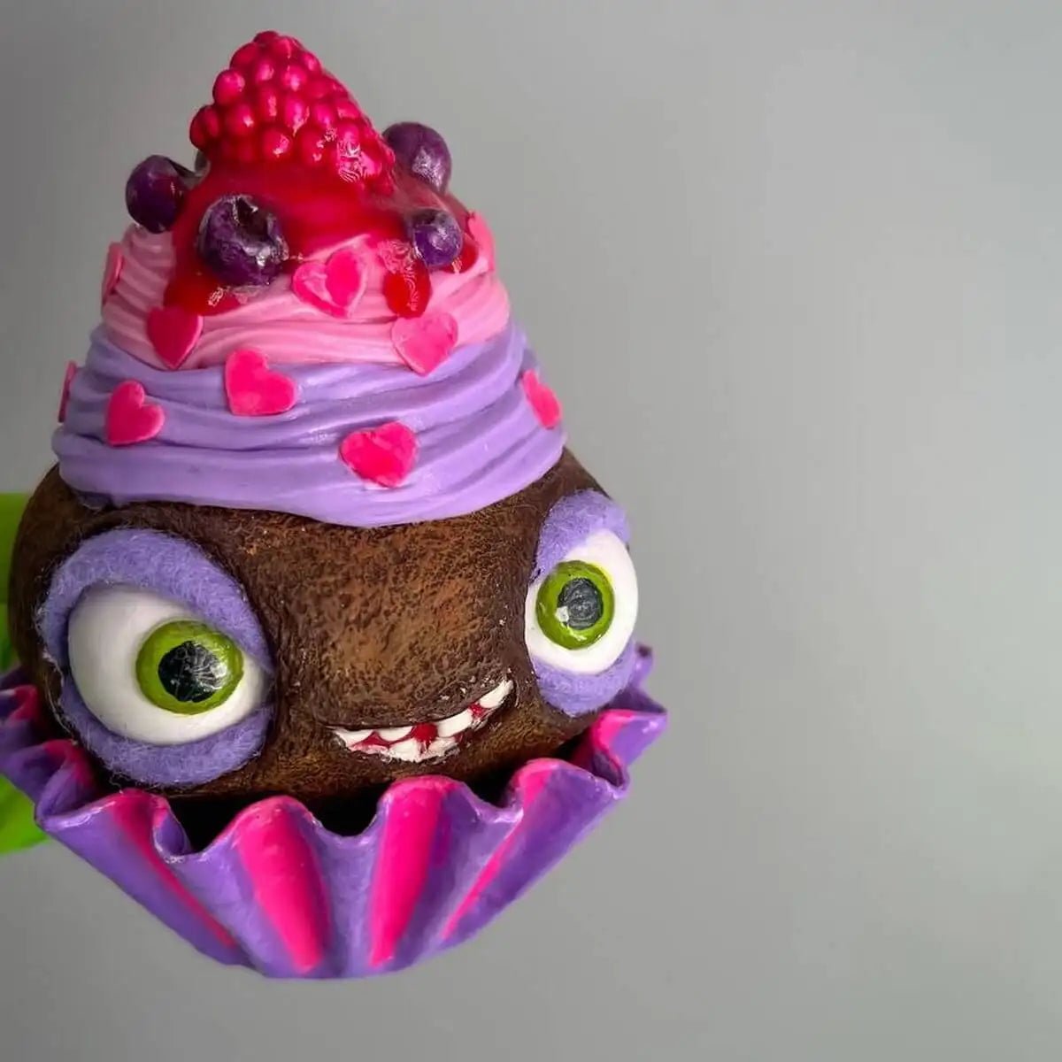 Chocolate raspberry cupcake with moving eyes – front view