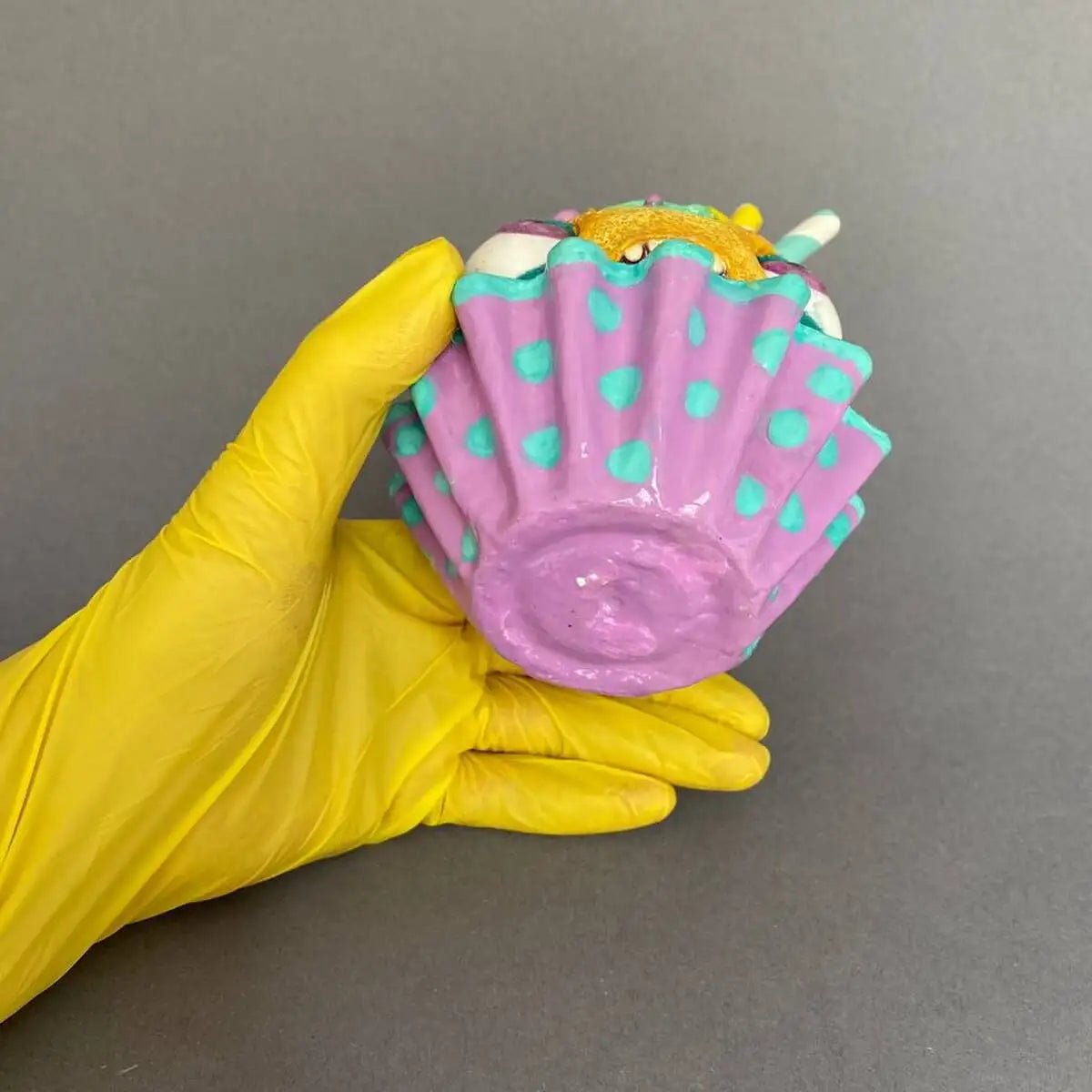 Bottom view of cupcake sculpture showing base details