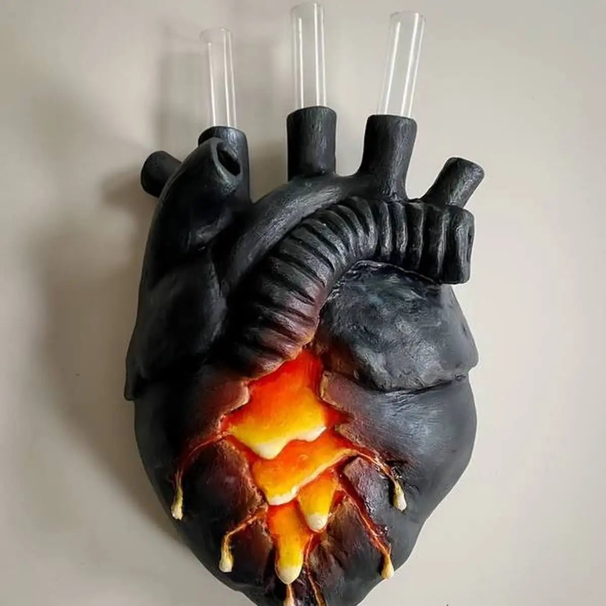 Lava heart wall vase with two empty glass tubes visible