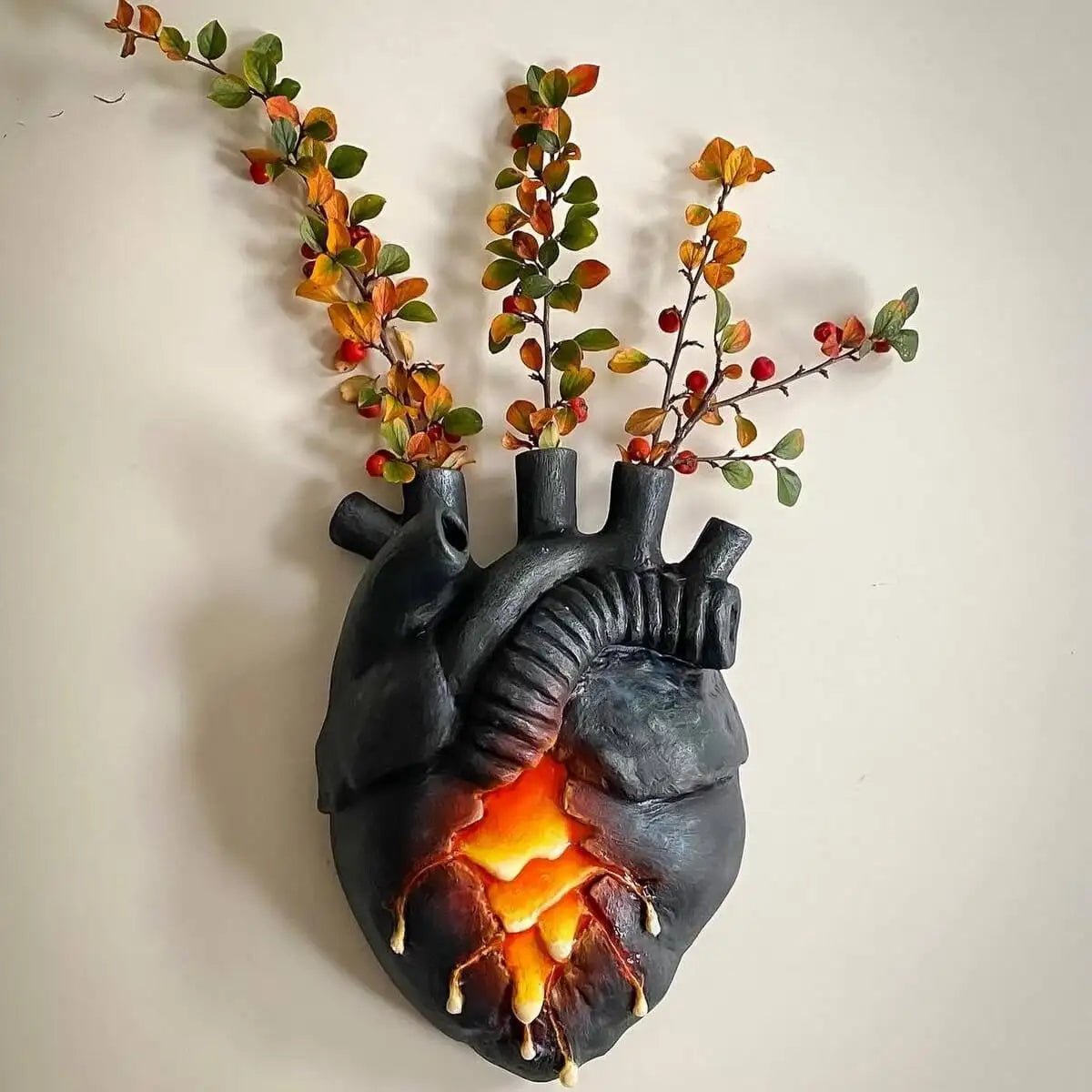 Heart wall vase mounted with branches inserted in glass tubes