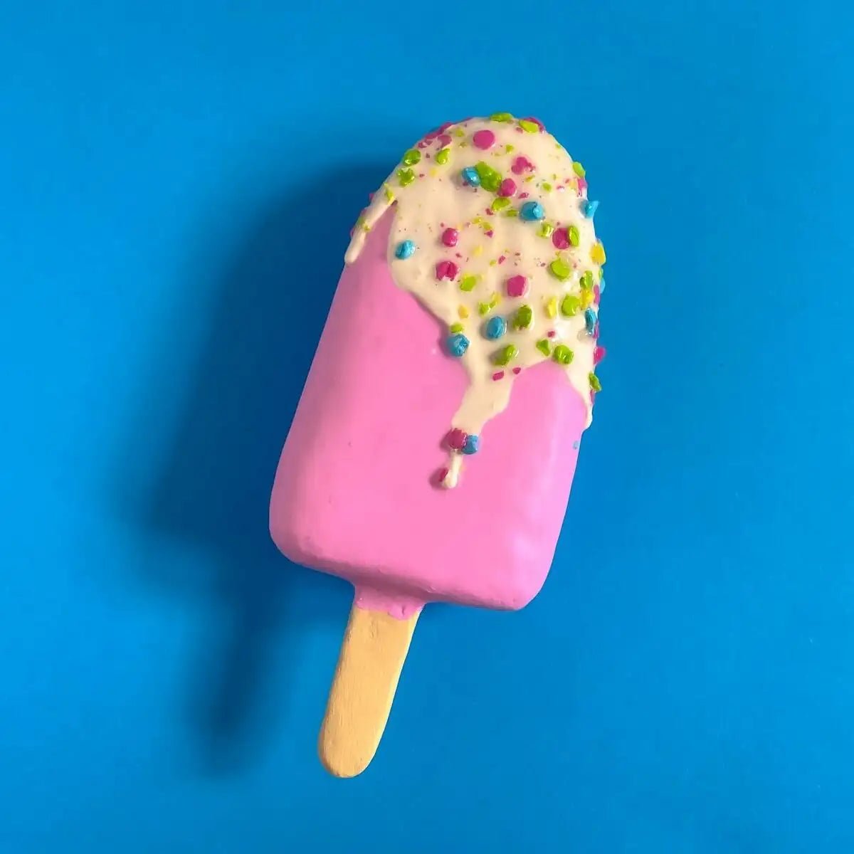 Flat lay of pink ice cream sculpture – top-down view