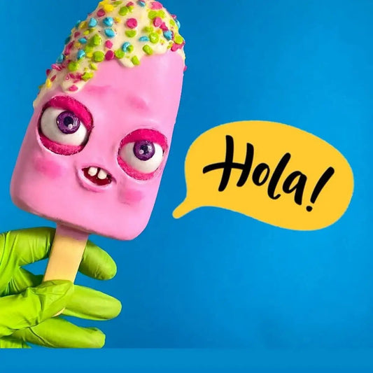 Pink ice cream figurine with moving eyes and “Hola” sign