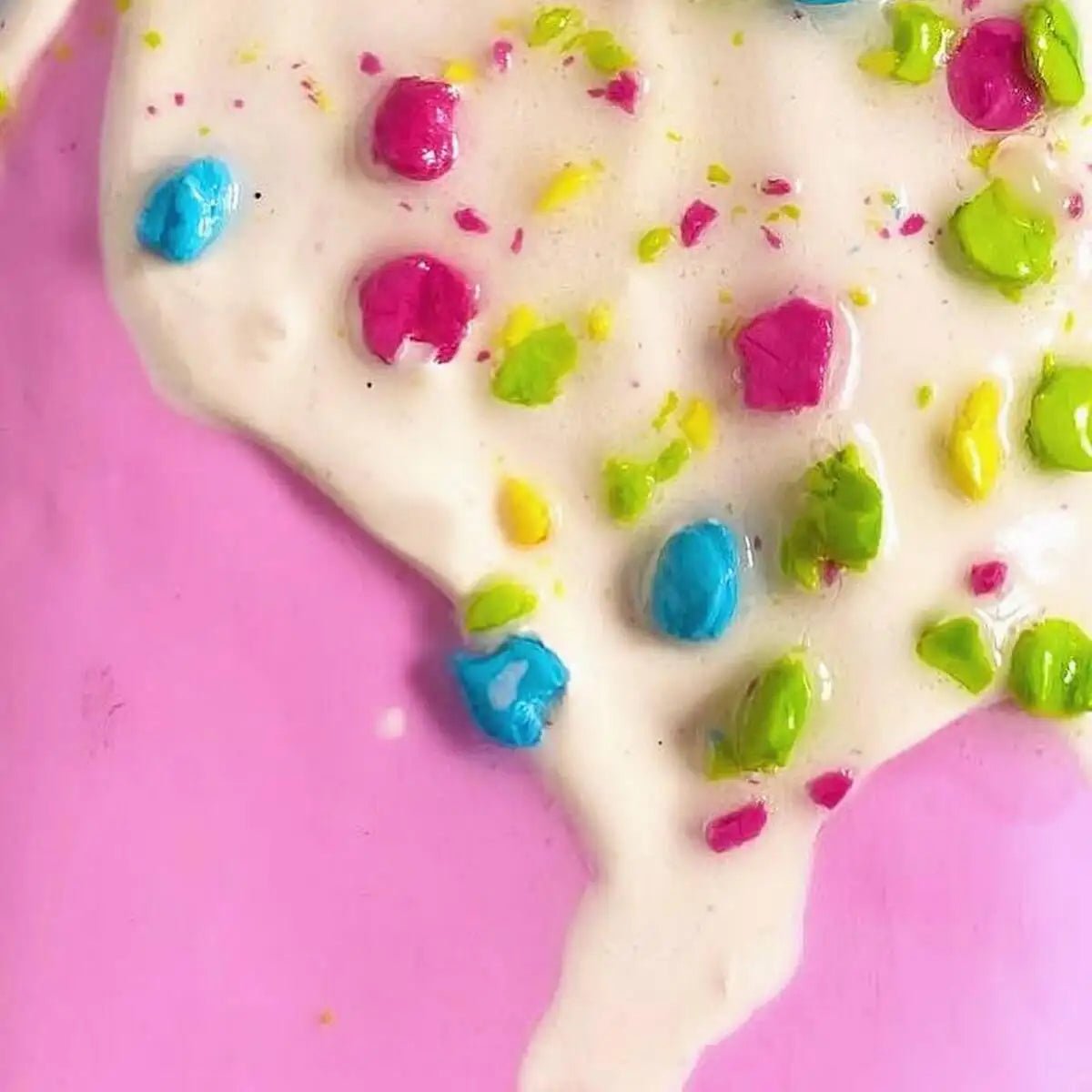 Detailed close-up of sprinkles and texture on pink ice cream sculpture