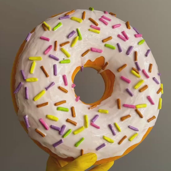 Video of white papier-mâché donut – texture, glaze, and sprinkle detail