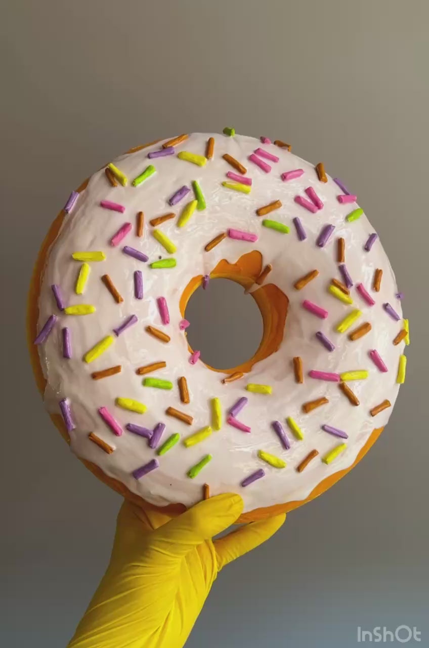 Video of white papier-mâché donut – texture, glaze, and sprinkle detail
