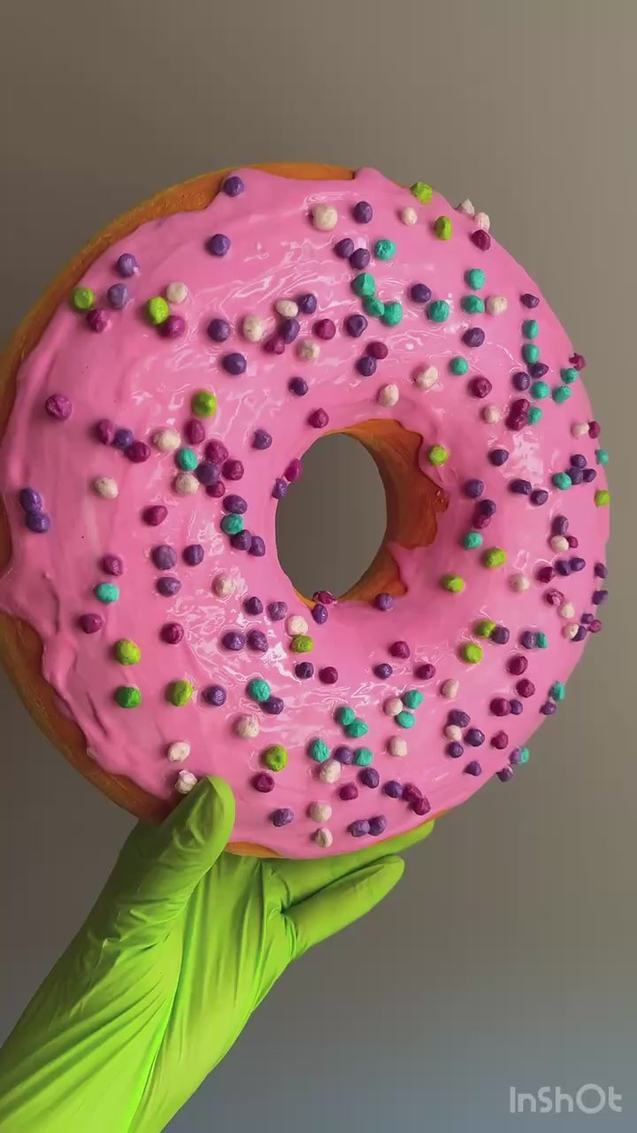 360° video of pink papier-mâché donut – close-up on glaze and sprinkles
