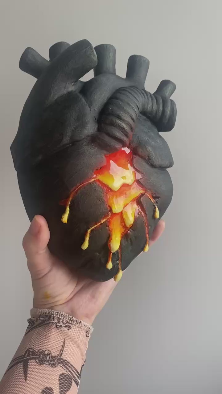 Video panning the handmade lava vase and glass tubes on the wall